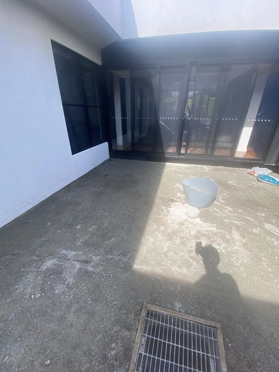 Before: Courtyard laid over concrete